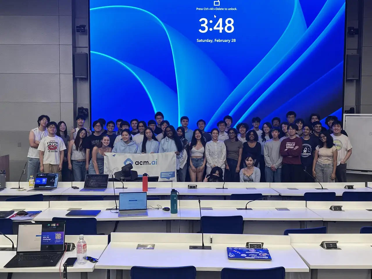 ACM AI members holding the acm.ai banner at the 2026 Mini ML Challenge